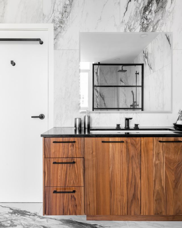 The natural wood grain of the vanity combined with the floor to ceiling marble tile give this high-end bathroom the ultimate wow factor. 

Cabinetry: Unique Natural Black Walnut, 45 door style
Designer: Jason Rolstone
Dealer: @thomasandbirchboutique
Photographer: @dashaaphotos

#hellocabico #cabicocabinets #luxurydesign #customcabinets #luxurybathroom #modernbathroom
