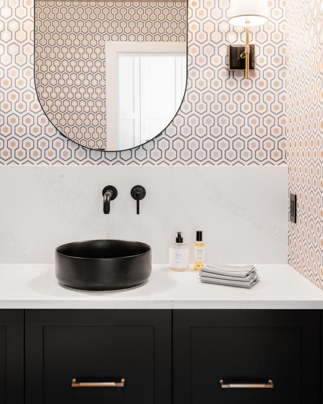 Sleek black vanity and geometric wallpaper for the perfect eclectic look! Embrace bold designs for a distinctive, chic style, especially in compact spaces. 

Essence Series Cabinetry: Midnight on Maple, Freddo door style
Designer: Gwen Long
Dealer: @thomasandbirchboutique
Photographer: @dashaaphotos

#hellocabico #cabicocabinets #luxurydesign #customcabinets #luxurybathroom #boldwallpaper #chicdesign #eclecticdesign