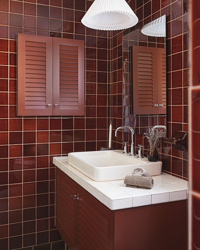 Dive back to the 1960s with this monochromatic retro bathroom. The tone-on-tone maroon cabinetry and tiles pay homage to the distinctive 60s design, infused with a touch of modernity that enhances its appeal, creating a nostalgic and captivating space.

Custom Unique Series Cabinetry
Designer: Cindy Raymond 
Photographer: @marc__halle @studio.arago

#cabico #cabicocabinetry #hellocabico #customcabinetry #customcabinets #interiordesign #luxurydesign #60sdesign #retrodesign #redbathroom