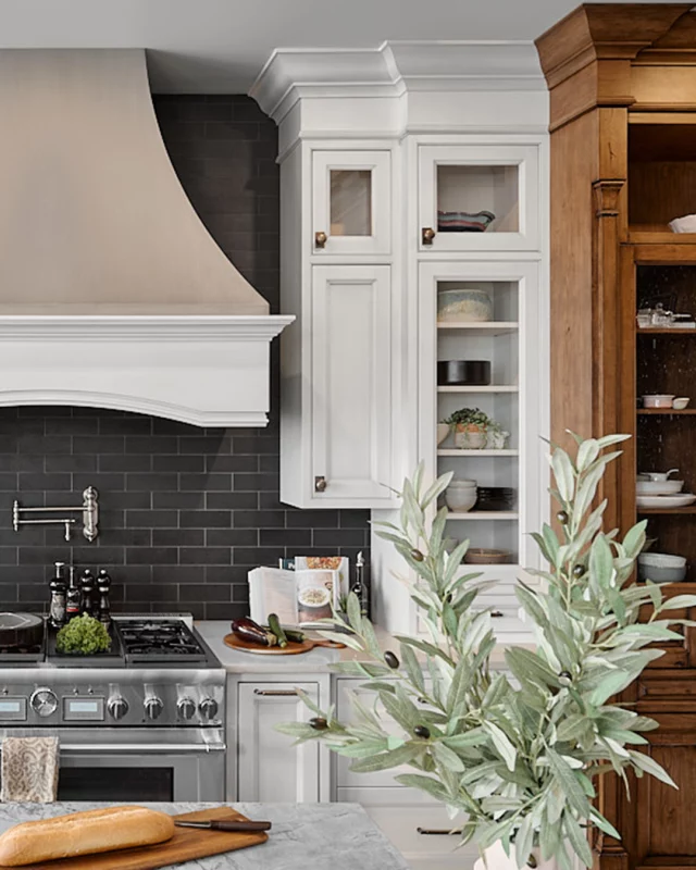 Discover the heart of the home with this exquisite kitchen design. The statement range hood adds a touch of grandeur, while thoughtful details make this kitchen a true masterpiece. 

Cabinetry: White Oyster on Maple and Vintage Dockside on Knotty Alder, Maranello door style
Dealer: Artisan Kitchen and Bath
Designer: Artisan Kitchen and Bath Team & Jennifer Renwick
Photographer: @alexouzilleau

#ElmwoodCabinetry #Elmwood #cabinetry #cabinets #customkitchen